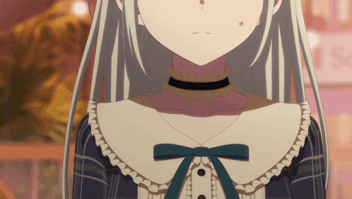 a close up of a girl 's neck and collar