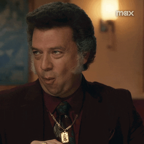 a man in a suit and tie with the word max on the bottom