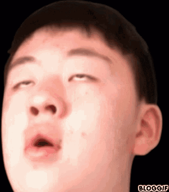 a close up of a man 's face with his eyes closed and the words bloggif below it
