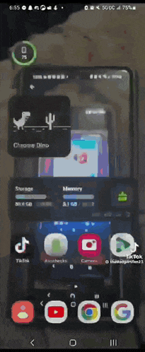 a phone screen shows the chrome dino game