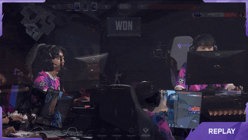 a group of people playing a video game with a purple overlay that says replay on it