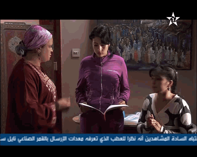 three women are standing in front of a painting and one of them is wearing a purple jacket that says oma style