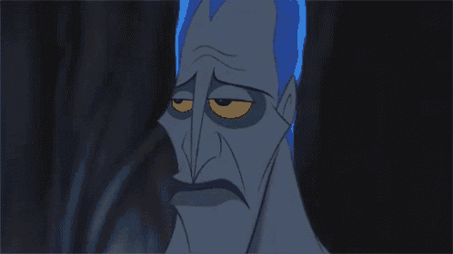 a cartoon character with blue hair and a sad look on his face .