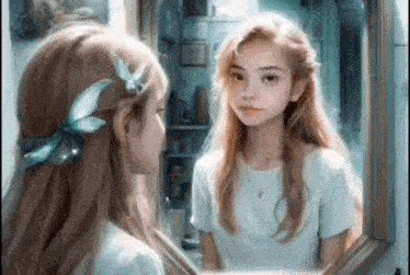 a young girl is looking at herself in the mirror .