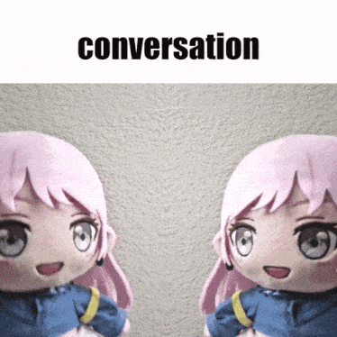 two stuffed dolls are standing next to each other and the word conversation is above them
