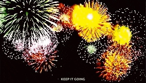 a fireworks display with the words keep it going in the bottom right corner