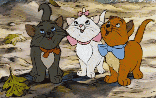 three cartoon cats with bows on their necks are standing next to each other