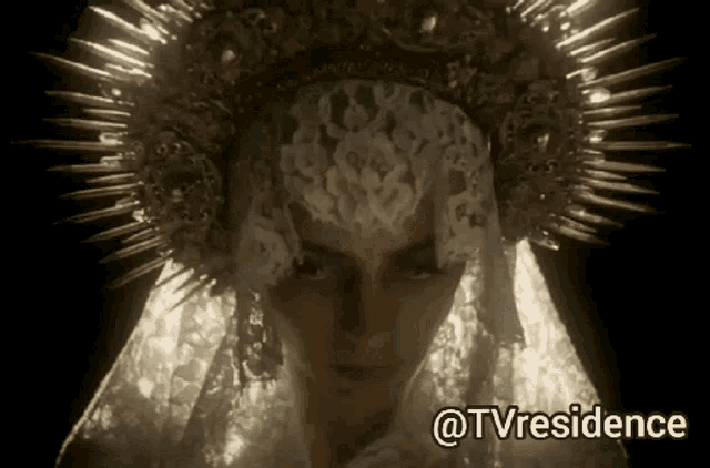 a woman with a crown on her head and the words @tvresidence below