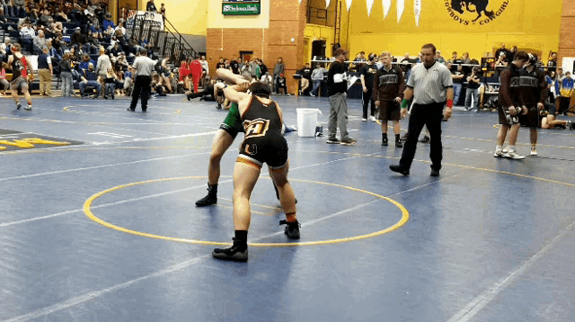 a wrestler with the number 27 on the back of his jersey