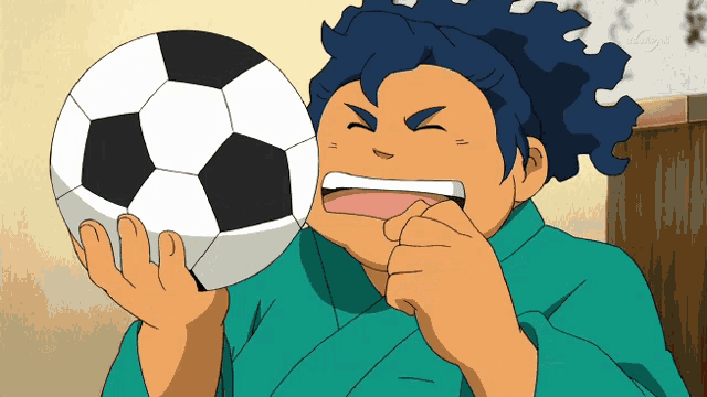 a cartoon character is holding a soccer ball in his hands