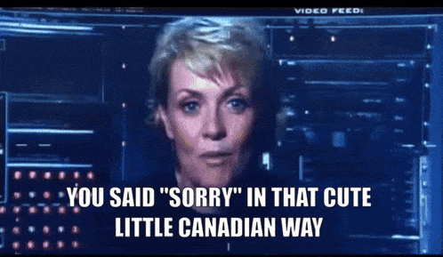a man and a woman are looking at a screen that says " you said " sorry " in that cute little canadian way "