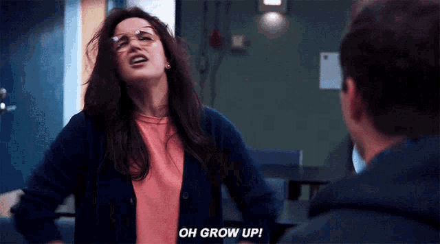 a woman with glasses is talking to a man and says oh grow up .