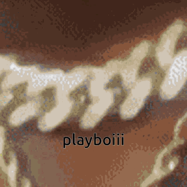 a close up of a chain with the word playboiii written below it
