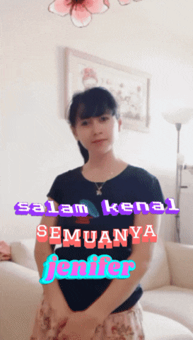 a woman is standing in front of a couch with the words salam kenal semuanya jennifer on the bottom