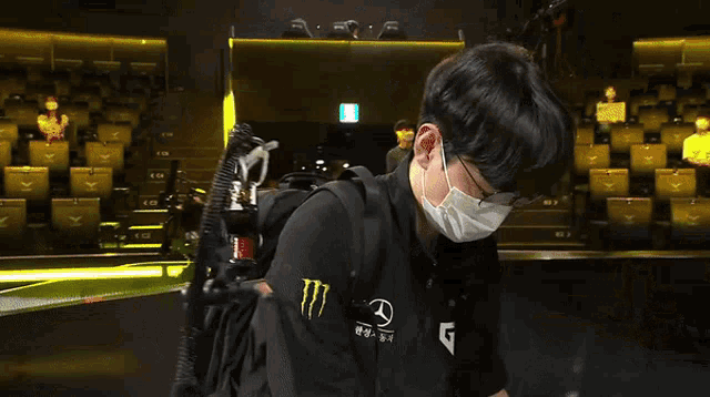 a man wearing a monster energy shirt and a mercedes logo on his jacket