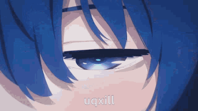 a close up of a person 's eye with uqxill written in white