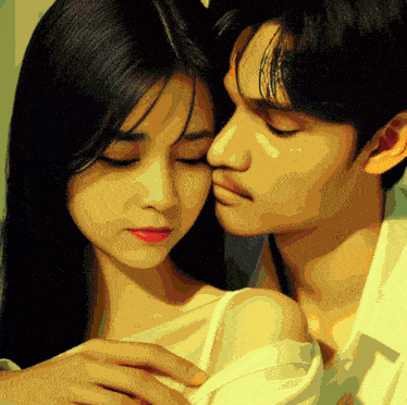 a man kisses a woman on the forehead with his eyes closed