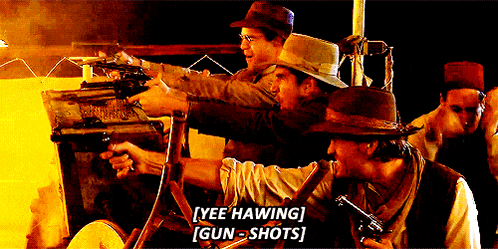 a group of men are holding guns and one of them says yee hawing gun-shots