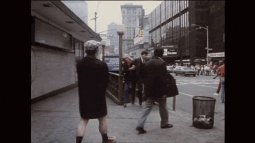 a busy street scene with a sign that says sony