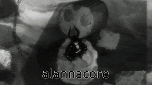 a black and white drawing of a skull with the words alannacore below it