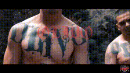 a man without a shirt has a tattoo on his chest that says " cristo "