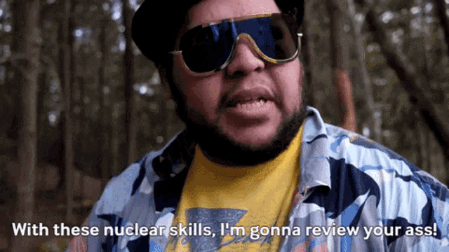 a man wearing sunglasses and a camouflage shirt says with these nuclear skills i 'm gonna review your ass