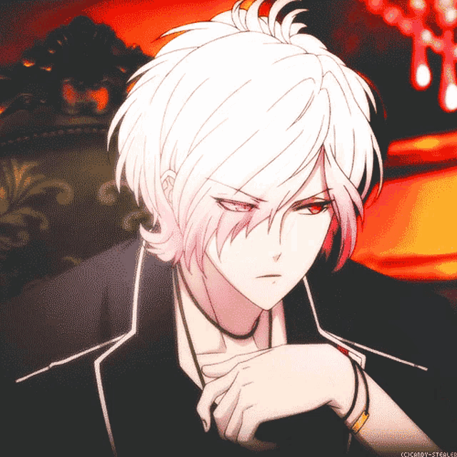 a man with white hair and red eyes is sitting in a chair with his hands on his chin