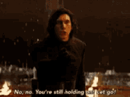 a man in a black coat is screaming and saying no no you 're still holding on let go