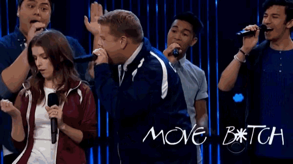 a group of people singing in front of a sign that says move b * tch
