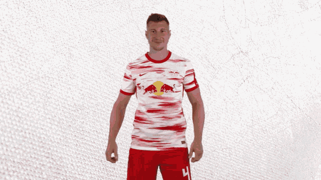 a man wearing a rb leipzig jersey with the number 4 on it