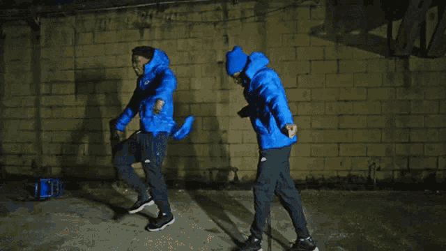 a person wearing a blue jacket and a blue hat