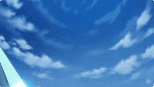 a blue sky with white clouds and a light coming out of it