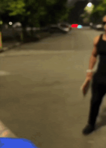 a blurry photo of a person walking down a street