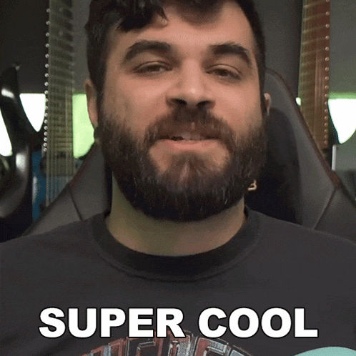 a man with a beard wearing a shirt that says super cool
