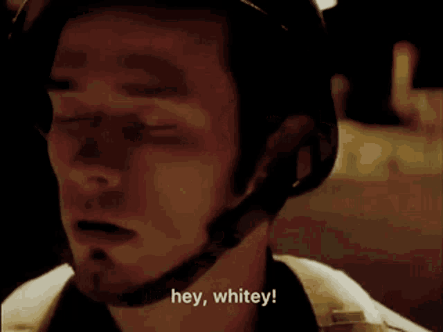 a man wearing a helmet says " hey whitey "