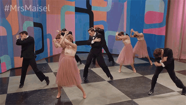 a group of people are dancing on a checkered floor with the hashtag #mrsmaisel
