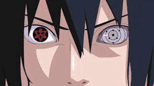 a close up of sasuke uchiha 's eyes with a star in the middle of them .