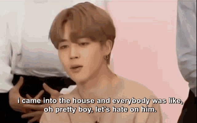 a man is talking about how he came into the house and everybody was like , oh pretty boy let 's hate on him .
