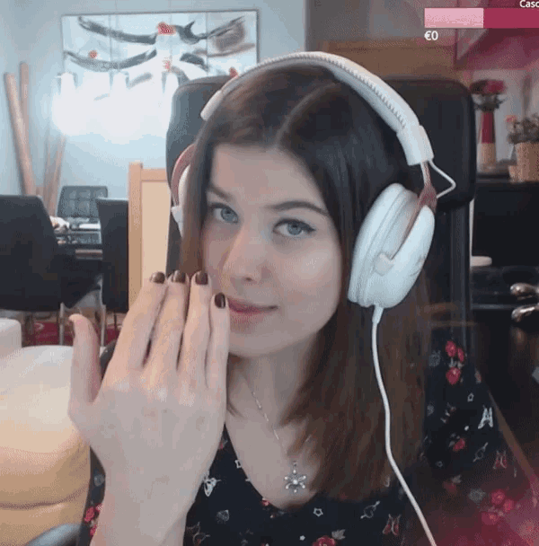 a woman wearing headphones has a pink bar above her that says casc