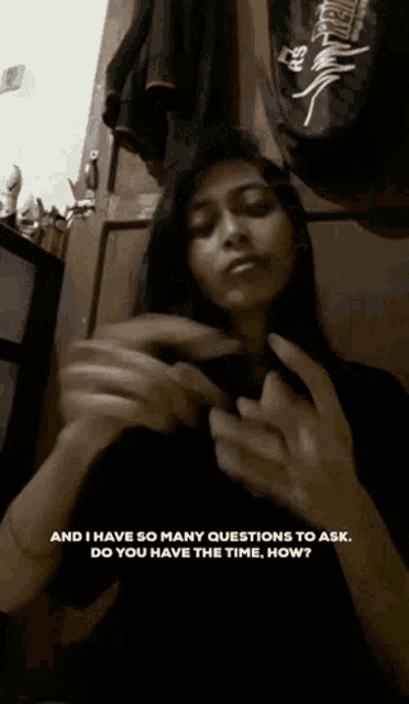a woman in a black shirt says " and i have so many questions to ask "
