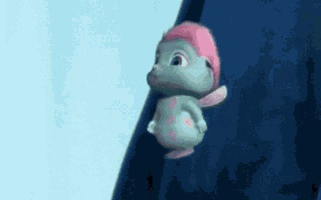 a cartoon character with a pink hair and wings is flying through the air .