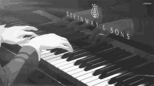a person is playing a steinway & sons grand piano