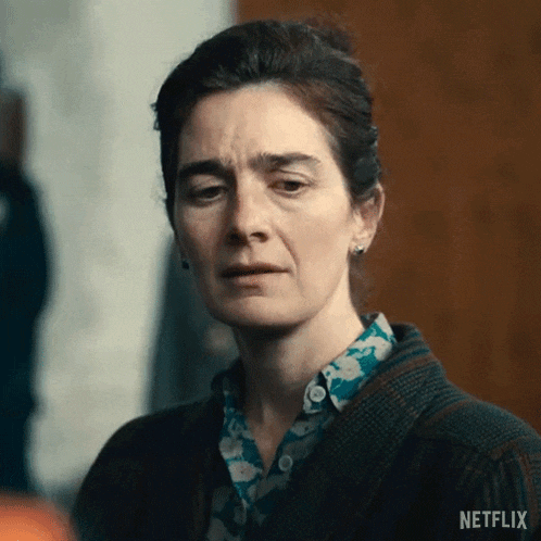 a close up of a woman 's face with a sad look on her face in a netflix trailer .