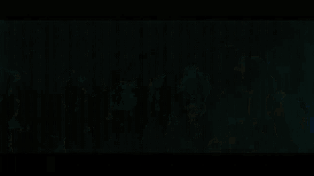 a group of people are dancing in a club