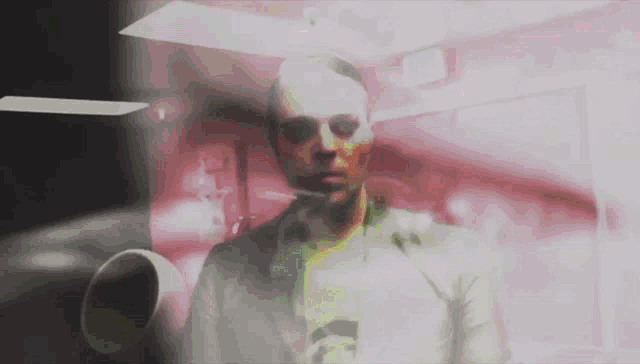 a man in a white shirt and tie stands in a dark room