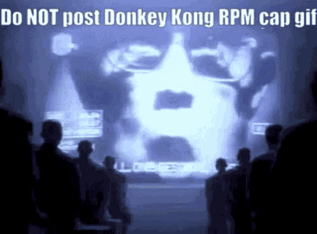 a group of people are watching a donkey kong rpm cap gif
