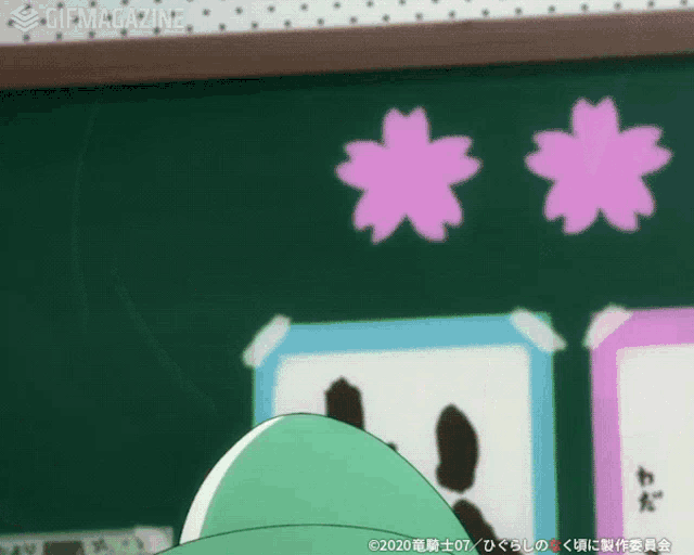 a blackboard with pink flowers on it and gifmagazine written on the bottom right