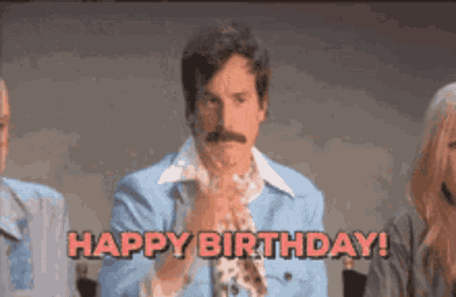 a man with a mustache says " happy birthday "