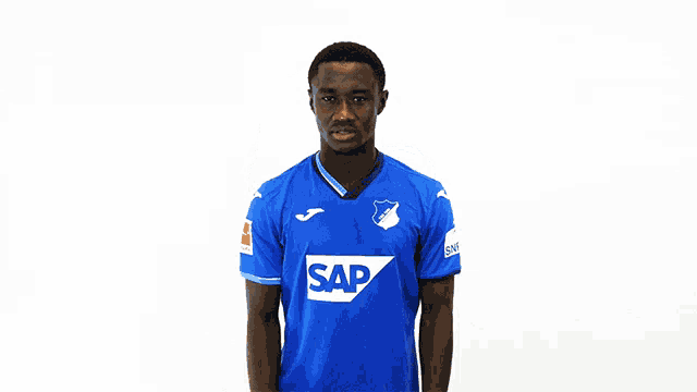 a man in a blue shirt with the word sap on the front