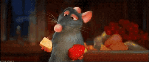 a cartoon rat is holding a strawberry and a piece of cheese